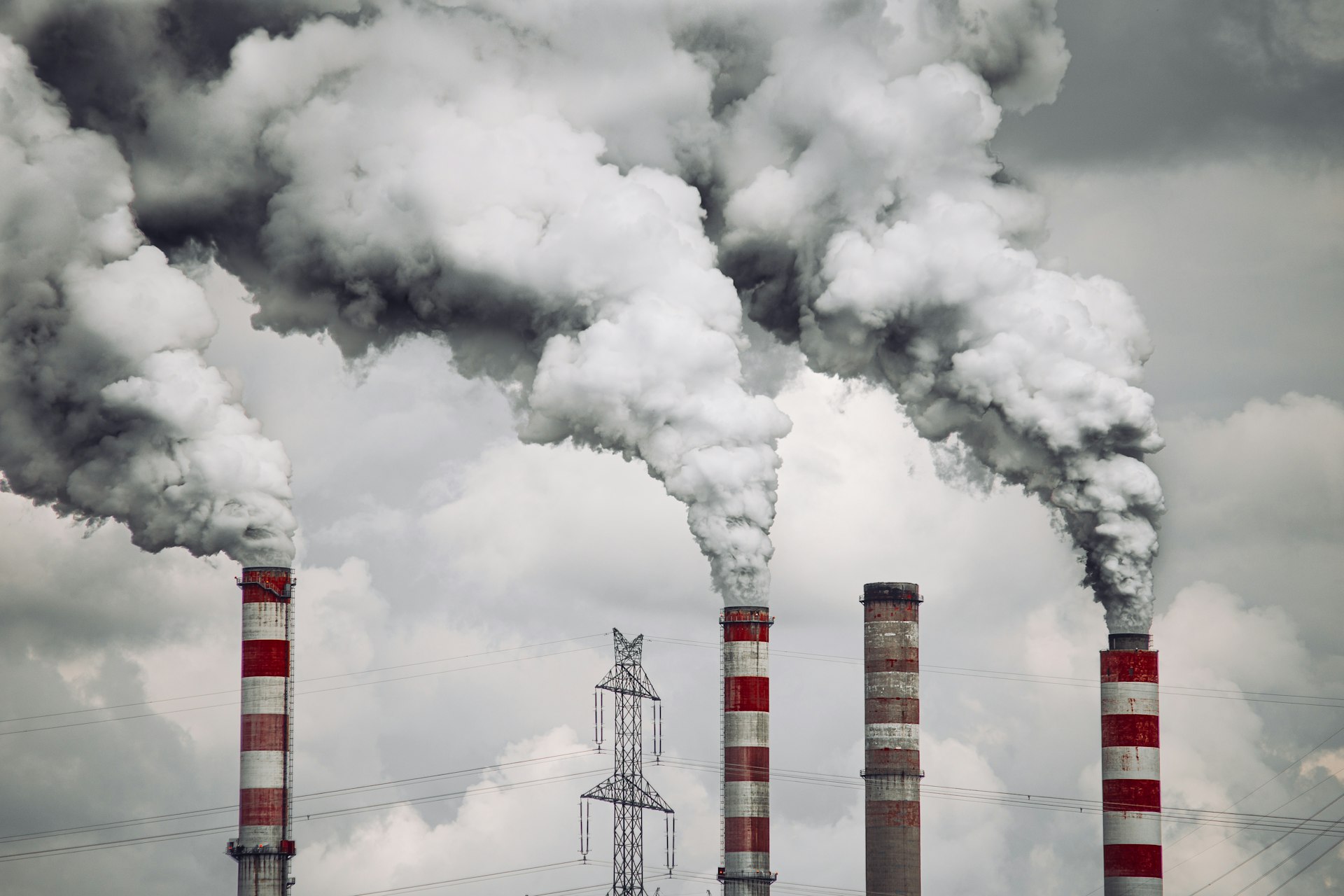 smoke billows from the stacks of smoke stacks